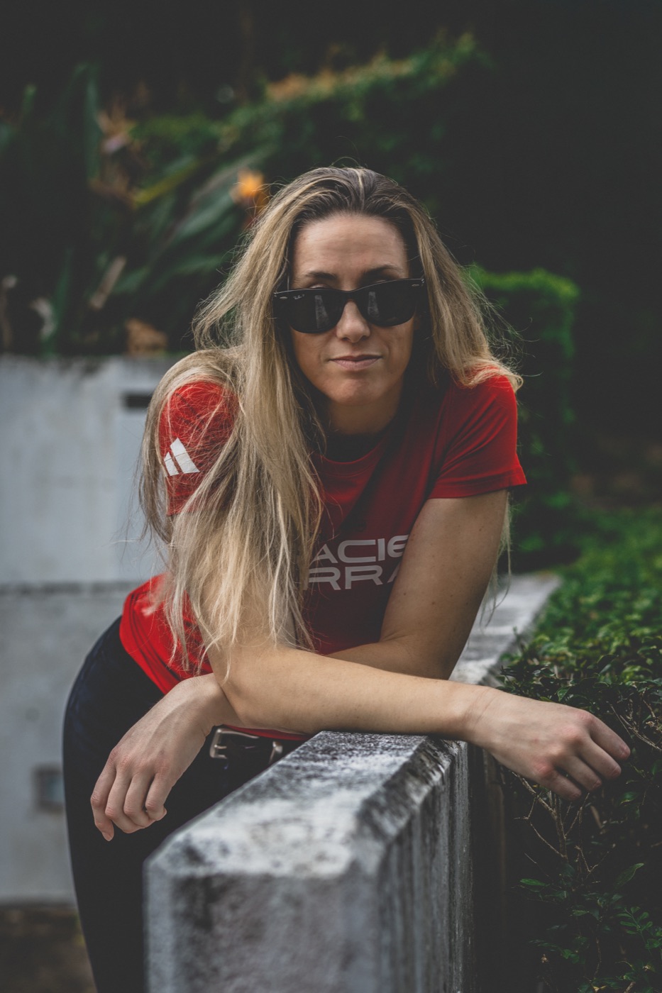Portrait of a Gracie Barra ambassador in sunglasses and team apparel.